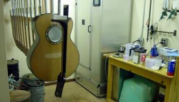 This room is next to the spray booth. The UV oven in the background is used to cure the finish with UV light. This room is also where the pore filling takes place.