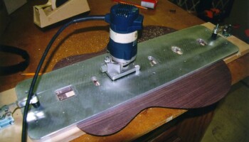 The router in action with the template. Here a clearance slot is being routed