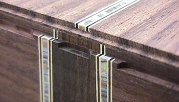 Once the body is assembled, its edges have to be very carefully routed to create a ledge for the binding. Jim has created several tools to help with this exacting task