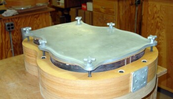 Here the top is being glued on using one of these radiused gluing cauls