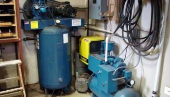 The air compressor, air drier, vacuum pump, and home made phase converter are on the main floor.