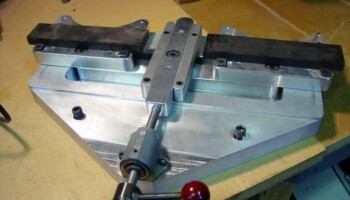 Here the vise is holding two bridge blanks for "facing". Because the vise "pivots" it can hold irregular shapes or even a tapered fingerboard