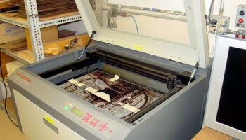 Front view of the laser cutter, opened for loading