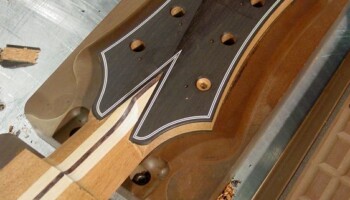 The peghead back located on the vacuum fixture and finished machining