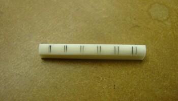 The string markings on the nut can be accurately laid out for cutting