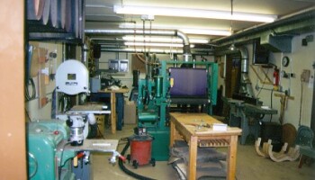 The "middle" room houses the thickness sander, two shapers, three bandsaws, two jointers, a vertical and horizontal belt sander, a thickness planer,and lots of routers!