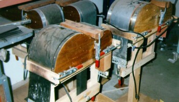 Four forms used for bending wood for sides, one for each body size. The electrical cords provide power to heaters that allow the wood to bend