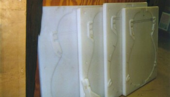 Tops get a similar treatment. Here you see vacuum press forms for gluing braces on tops